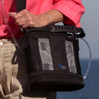 OxyGo portable oxygen concentrator in its carrying bag