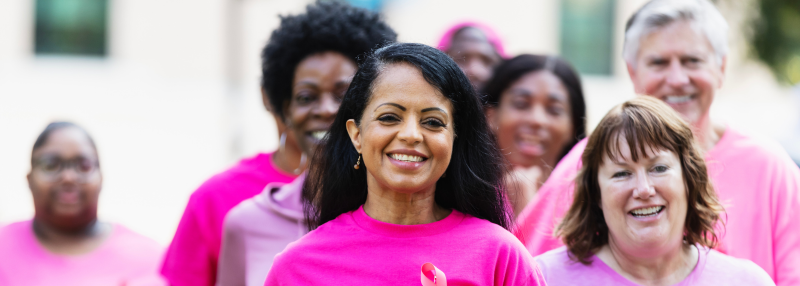 Group of women in pink Breast Cancer Awareness shirts